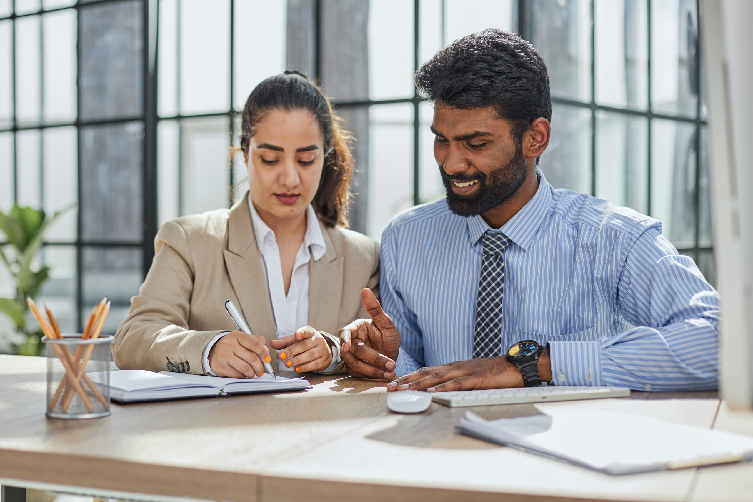 young account manager advisor lawyer showing paper documents partner scaled - Techkeymonk